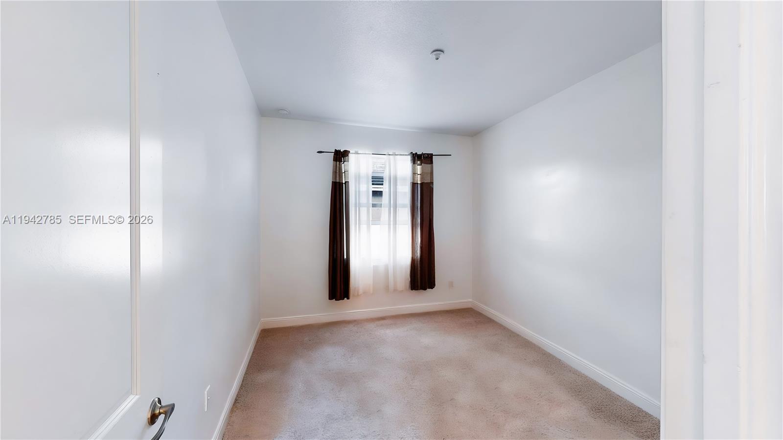 231 Northeast 33rd Terrace Homestead, FL 33033 - Photo 39 of 87 an empty room with windows and closet