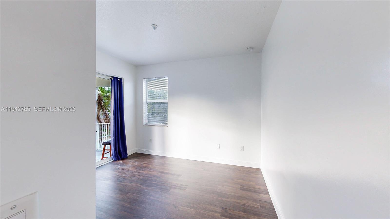 231 Northeast 33rd Terrace Homestead, FL 33033 - Photo 41 of 87 a view of an empty room with wooden floor and closet