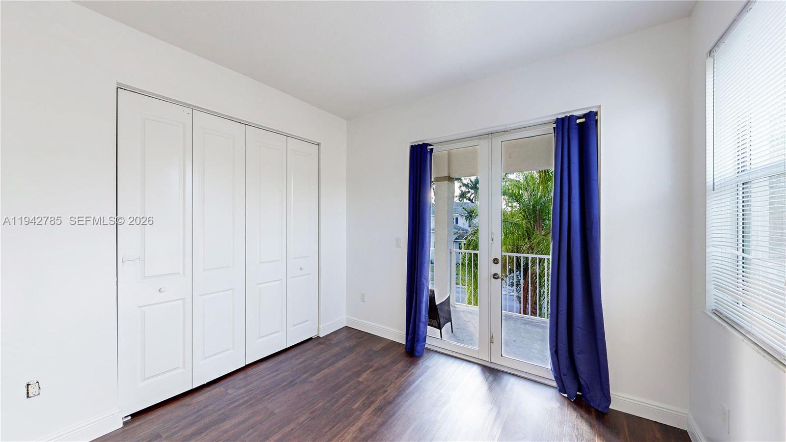 231 Northeast 33rd Terrace Homestead, FL 33033 - Photo 43 of 87 a view of a hallway with wooden floor and windows