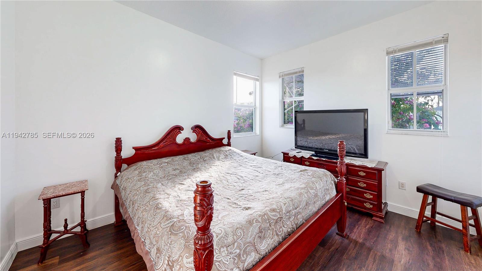 231 Northeast 33rd Terrace Homestead, FL 33033 - Photo 45 of 87 a bedroom with a bed and a flat screen tv