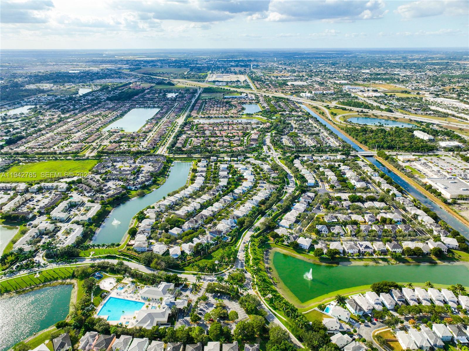 231 Northeast 33rd Terrace Homestead, FL 33033 - Photo 74 of 87 an aerial view of residential building and lake