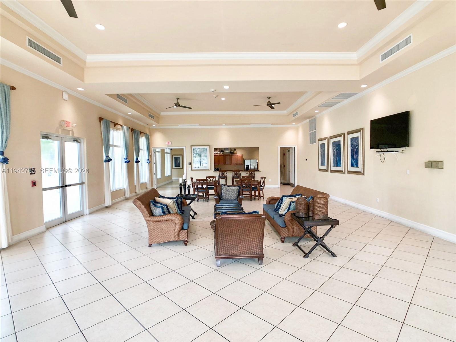 231 Northeast 33rd Terrace Homestead, FL 33033 - Photo 77 of 87 a living room with furniture and a flat screen tv