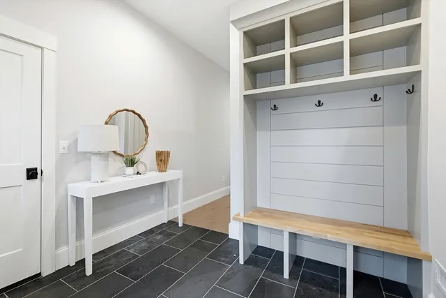 a view of a room that has a table and chair