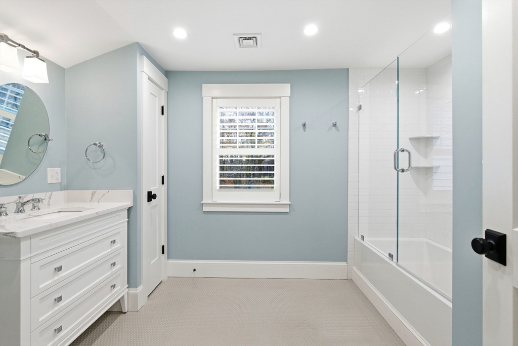 178 Hersey Street Hingham, MA 02043 - Photo 22 of 23 a bathroom with a tub sink and mirror