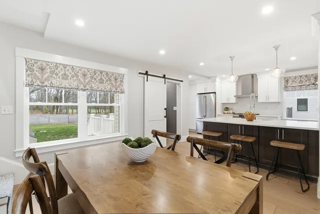 a view of a dining room with furniture window and outside view