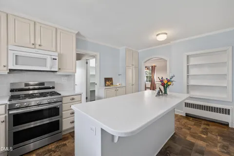 a bathroom with a sink a light fixture and a mirror