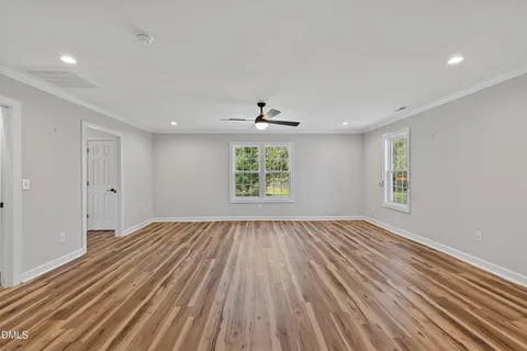 a view of empty room with a fireplace and cabinet