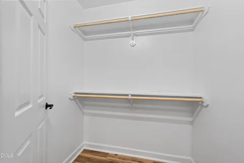 a view of a house with a yard covered in snow