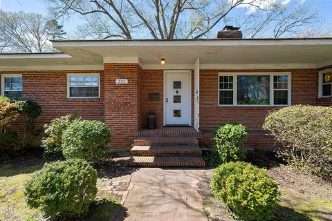 a view of a room with wooden floor and a window