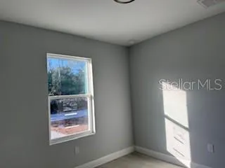 a view of an empty room and window