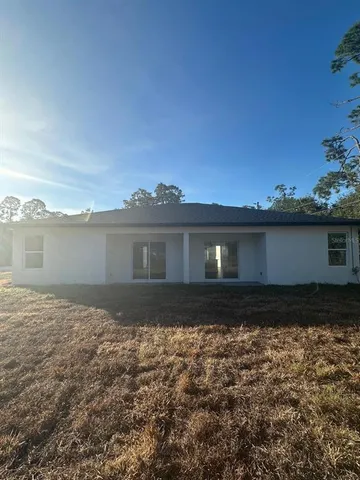 a view of swimming pool with a yard