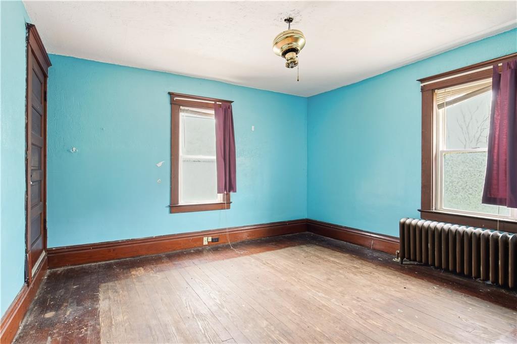 103 Wash Run Road White, PA 15490 - Photo 28 of 35 a view of an empty room with a window and wooden floor