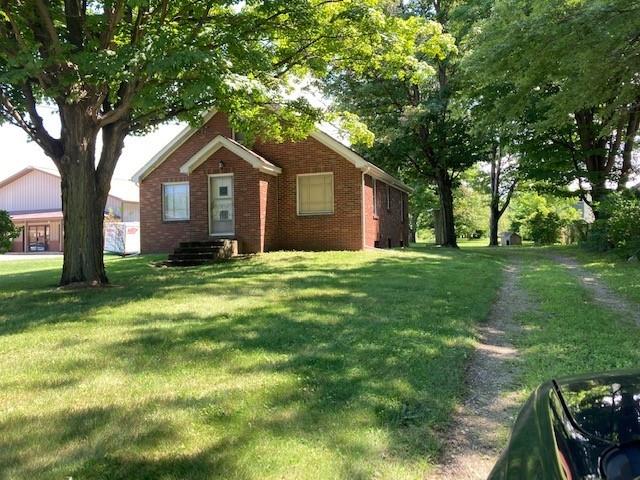 5041 Buffalo Road Erie, PA 16510 - Photo 1 of 1 a front view of a house with yard and green space