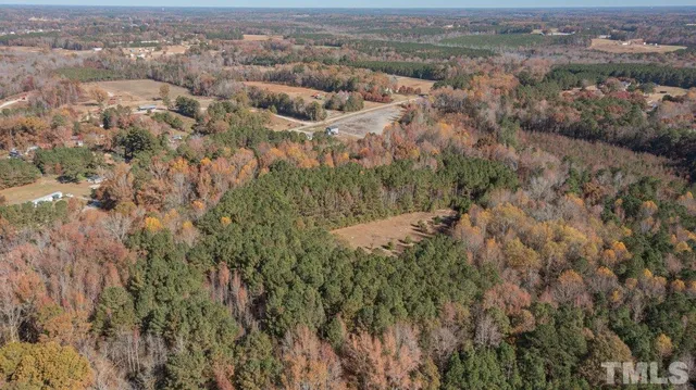 an aerial view of house with yard and mountain view