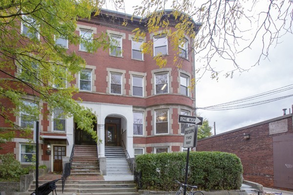 a front view of a multi story residential apartment building
