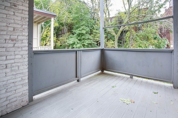 7-9 University Road Brookline, MA 02445 - Photo 12 of 17 a view of an empty room with a window and brick walls