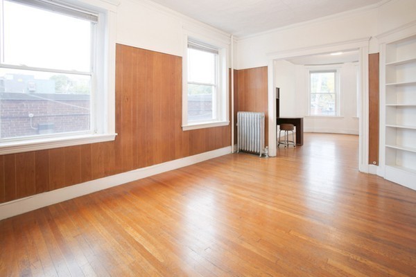 7-9 University Road Brookline, MA 02445 - Photo 14 of 17 a view of empty room with wooden floor and fan