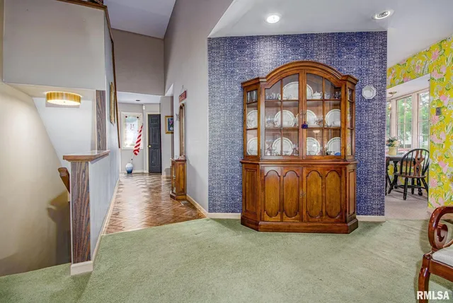 a view of hall way with furniture