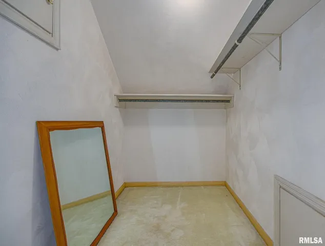 a view of an empty walk in closet