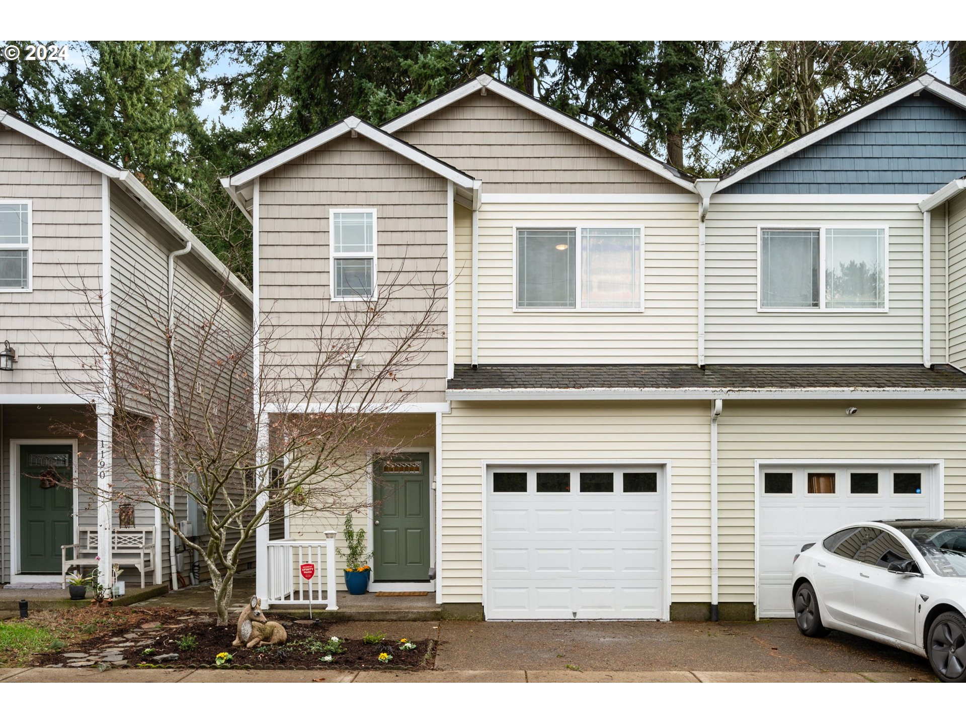 1186 Northeast 106th Avenue Portland, OR 97220 - Photo 1 of 22 a view of a white house with a white wooden fence