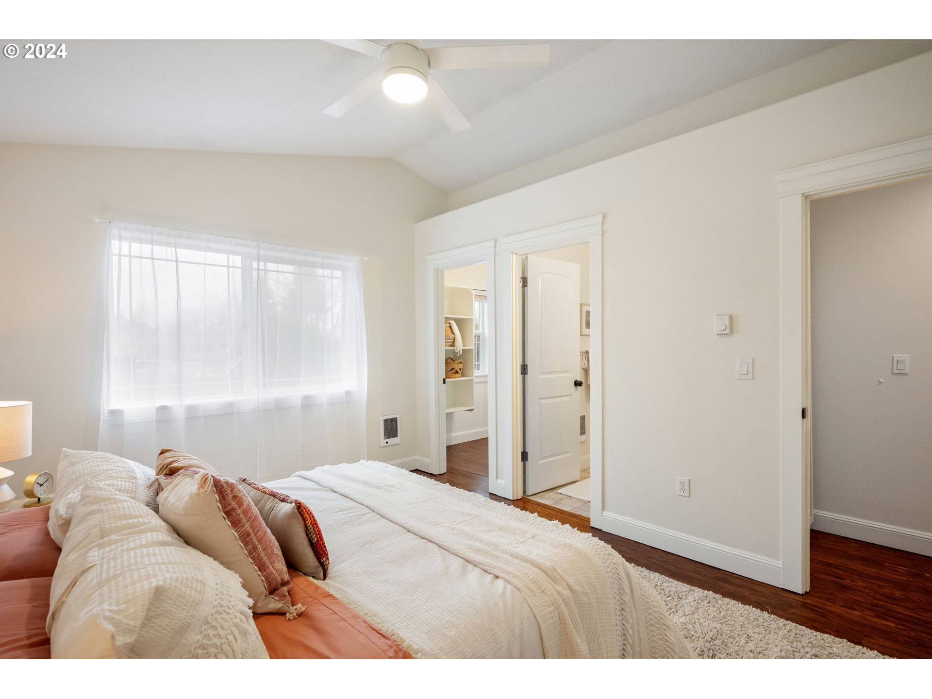 1186 Northeast 106th Avenue Portland, OR 97220 - Photo 12 of 22 a bedroom with a bed and a large window
