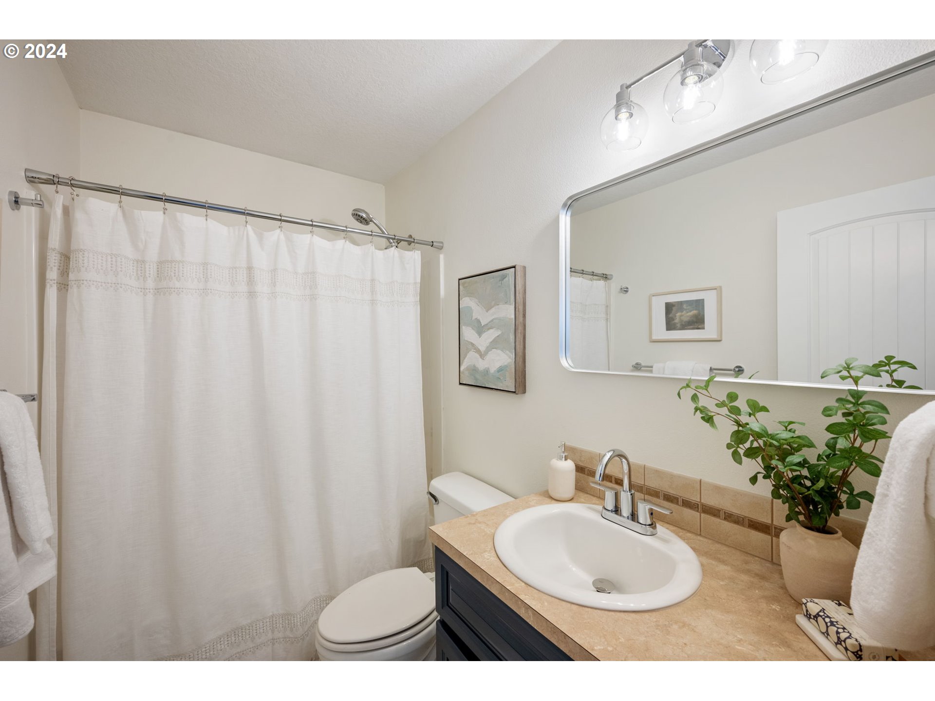 1186 Northeast 106th Avenue Portland, OR 97220 - Photo 13 of 22 a bathroom with a sink toilet and mirror