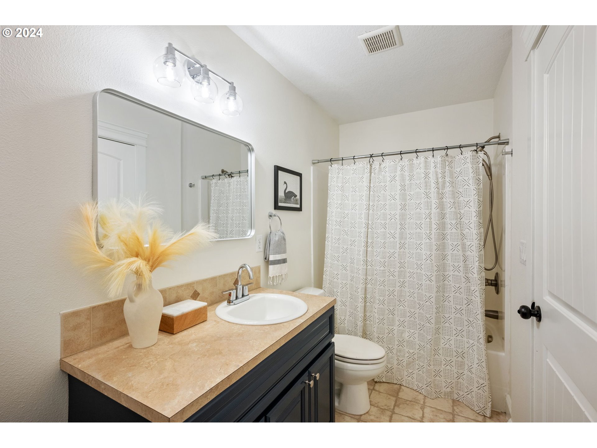 1186 Northeast 106th Avenue Portland, OR 97220 - Photo 18 of 22 a bathroom with a sink toilet a mirror and shower curtain