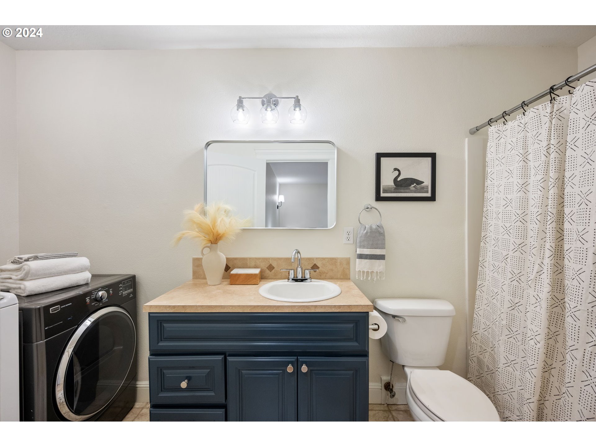 1186 Northeast 106th Avenue Portland, OR 97220 - Photo 19 of 22 a bathroom with a sink a toilet and a mirror