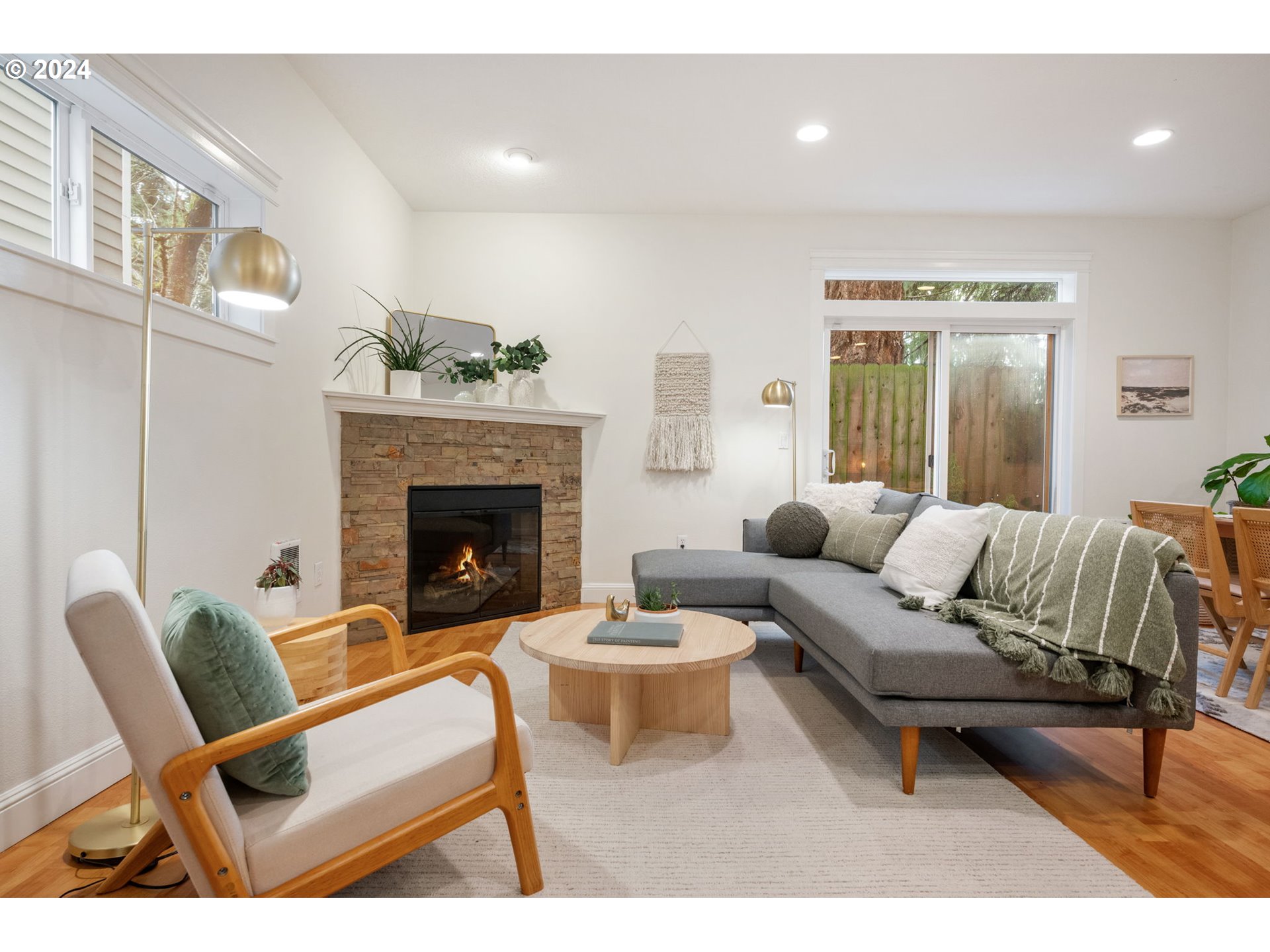 1186 Northeast 106th Avenue Portland, OR 97220 - Photo 4 of 22 a living room with furniture and a fireplace