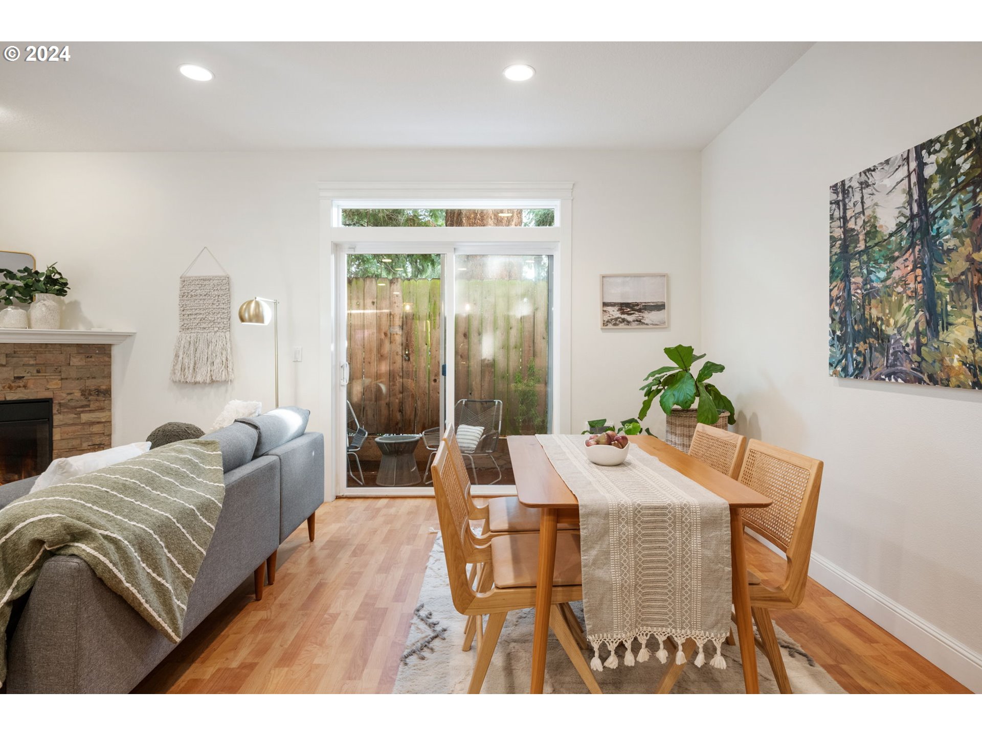 1186 Northeast 106th Avenue Portland, OR 97220 - Photo 5 of 22 a view of a dining room with furniture and a potted plant