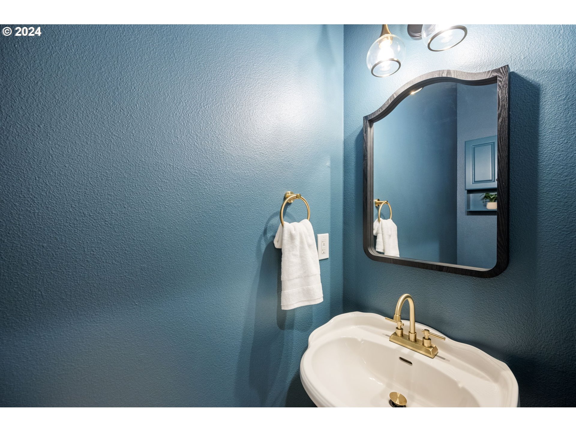 1186 Northeast 106th Avenue Portland, OR 97220 - Photo 9 of 22 a bathroom with a sink and mirror