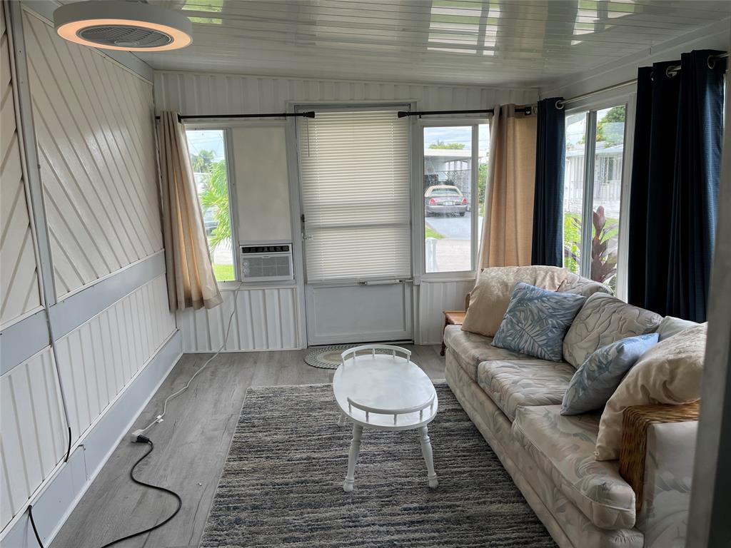 1910 Southwest 85th Terrace Davie, FL 33324 - Photo 11 of 22 a living room with furniture and a rug