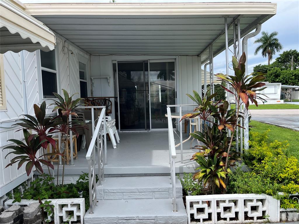 1910 Southwest 85th Terrace Davie, FL 33324 - Photo 12 of 22 a view of front door and potted plants
