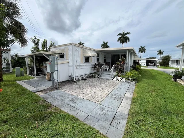 a bedroom with a bed and a mirror