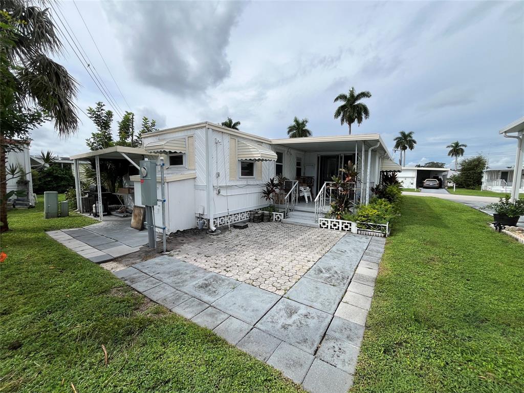 1910 Southwest 85th Terrace Davie, FL 33324 - Photo 14 of 22 a view of a house with yard and sitting area