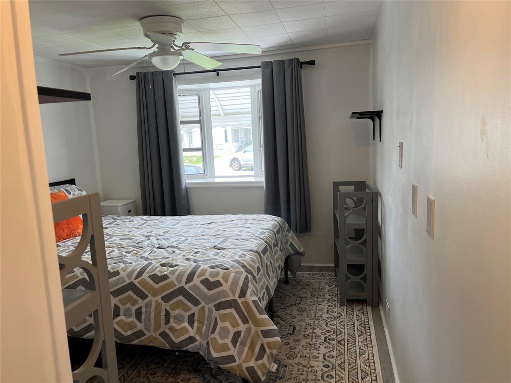 1910 Southwest 85th Terrace Davie, FL 33324 - Photo 16 of 22 a bedroom with a bed and a window