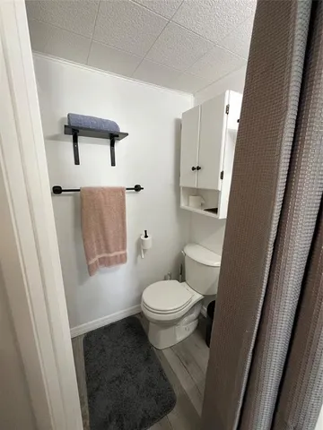 a bathroom with a shower and a mirror