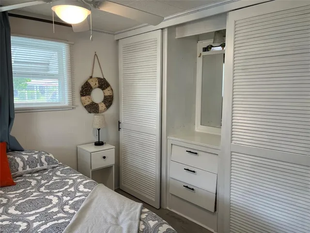 a bathroom with a sink a toilet and shower curtain