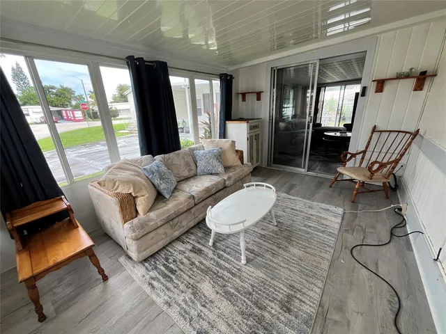 a living room with furniture and a rug