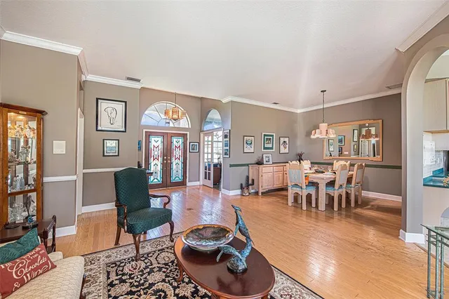 a large kitchen with lots of counter and chairs