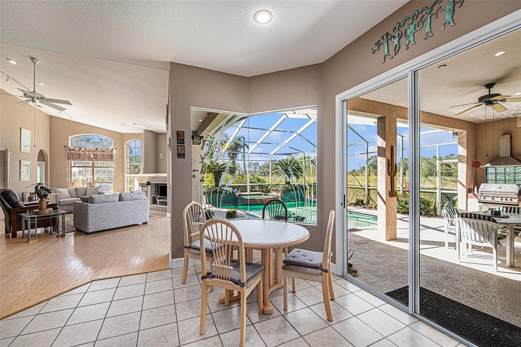 331 Lewis Road Lithia, FL 33547 - Photo 15 of 87 a outdoor space with lots of furniture and glass windows