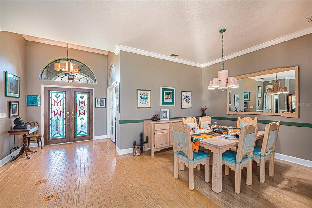 331 Lewis Road Lithia, FL 33547 - Photo 17 of 87 a view of a dining room with furniture window and wooden floor