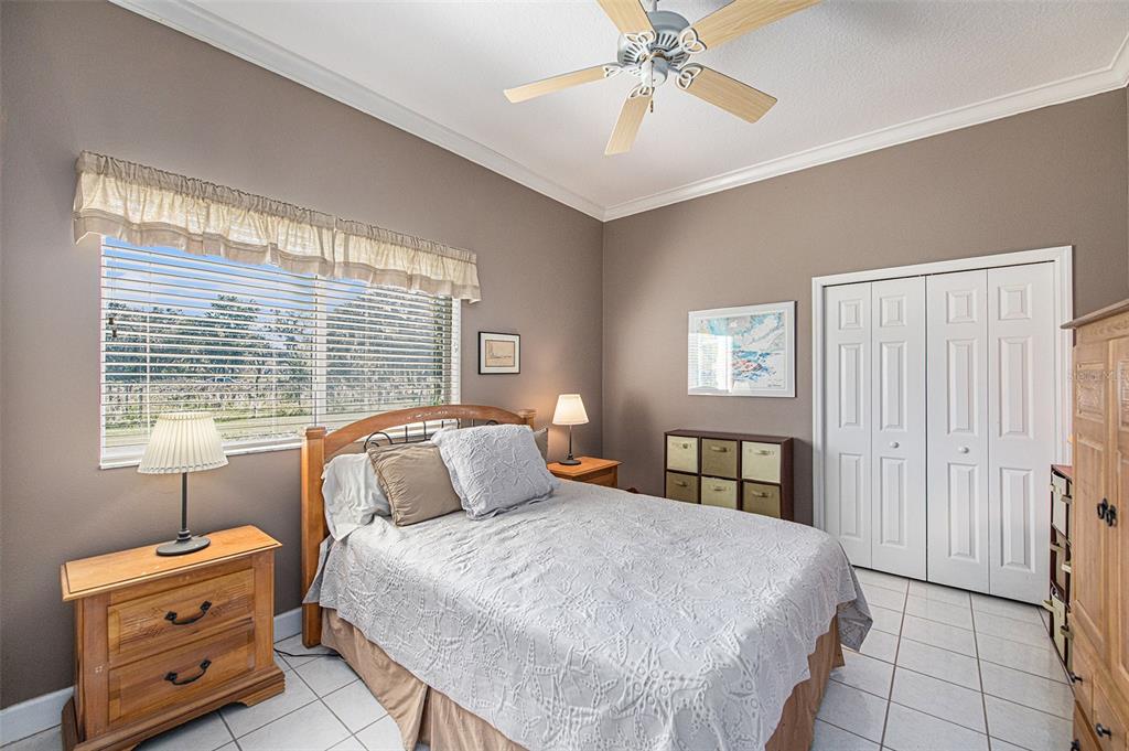 331 Lewis Road Lithia, FL 33547 - Photo 25 of 87 a bedroom with a large bed and a window