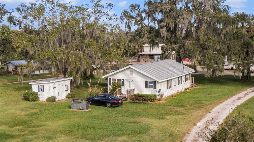 331 Lewis Road Lithia, FL 33547 - Photo 33 of 87 a view of a house with a yard and sitting area