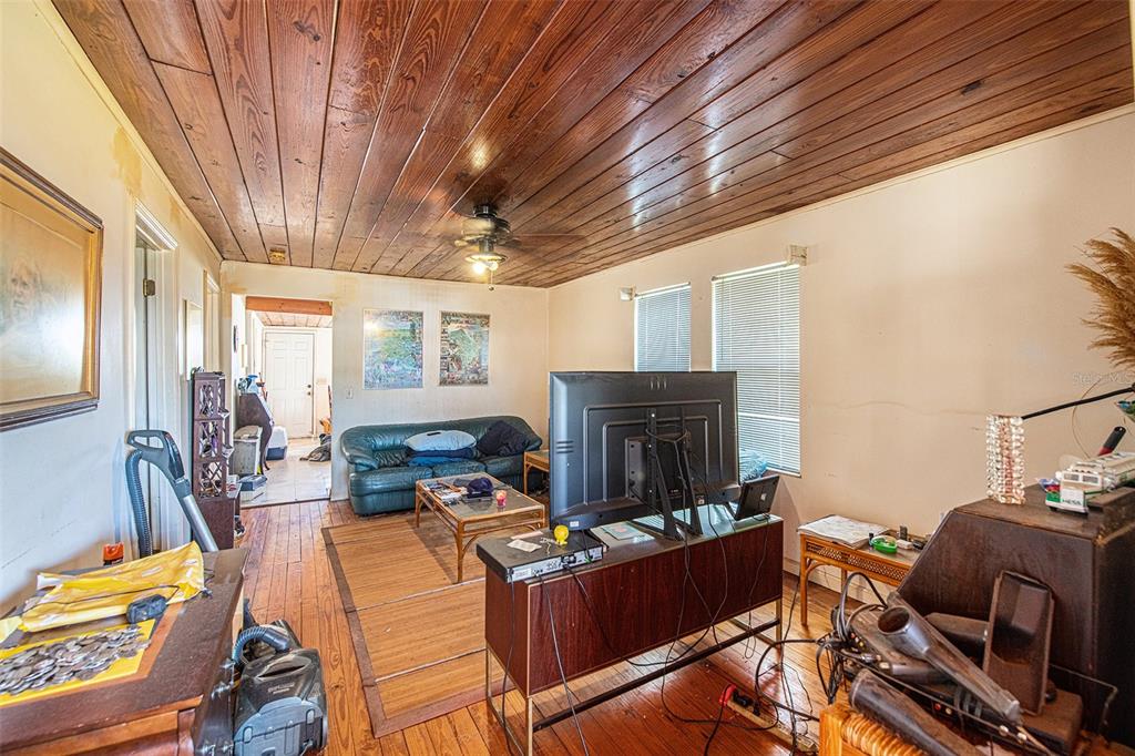 331 Lewis Road Lithia, FL 33547 - Photo 35 of 87 a living room with furniture a flat screen tv and a fireplace