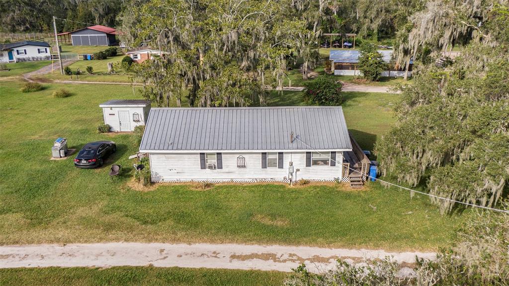 331 Lewis Road Lithia, FL 33547 - Photo 35 of 87 an aerial view of a house with a yard basket ball court and outdoor seating