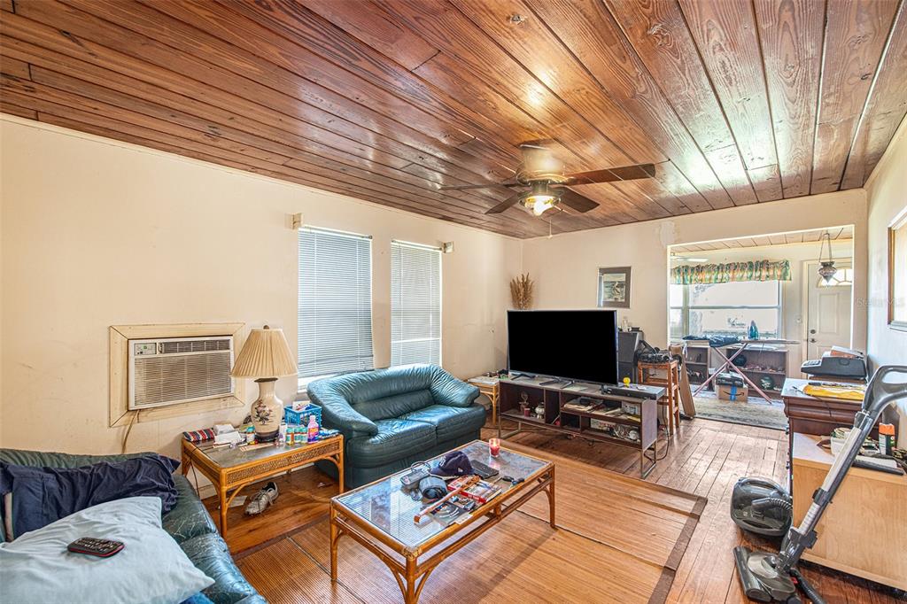 331 Lewis Road Lithia, FL 33547 - Photo 37 of 87 a living room with furniture and a flat screen tv