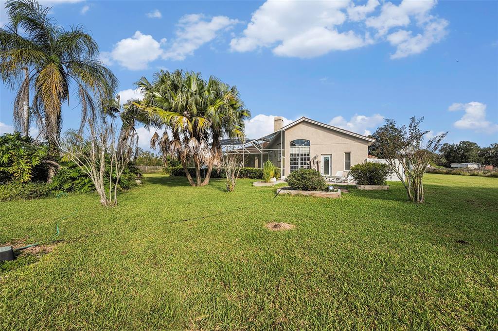 331 Lewis Road Lithia, FL 33547 - Photo 57 of 87 a view of a house with a yard