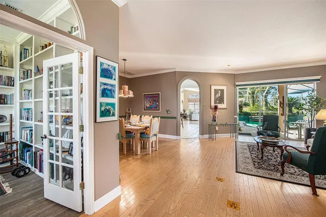 a living room with furniture a rug and a window