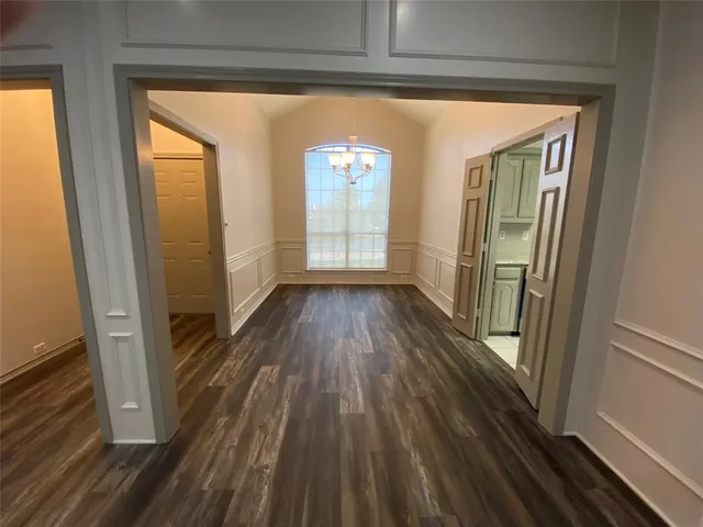 a view of gallery with wooden floor